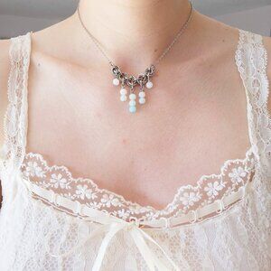Vintage antique V-shaped pearl necklace with a small silver chain
